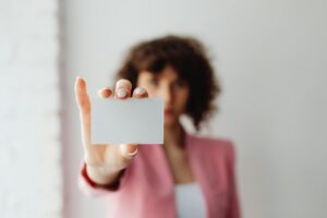 A brand visibility expert with a blank business card