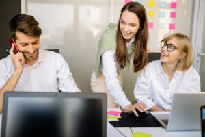 Young sales and marketing professionals working together